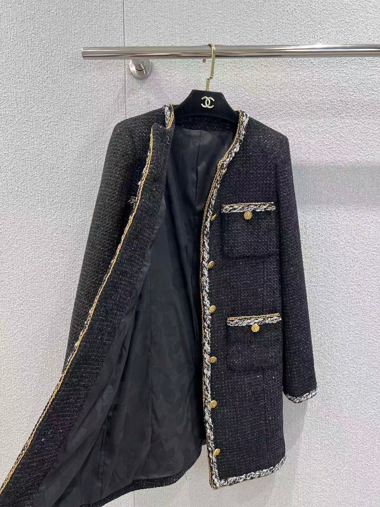 Black and gold four-pocket tweed coat