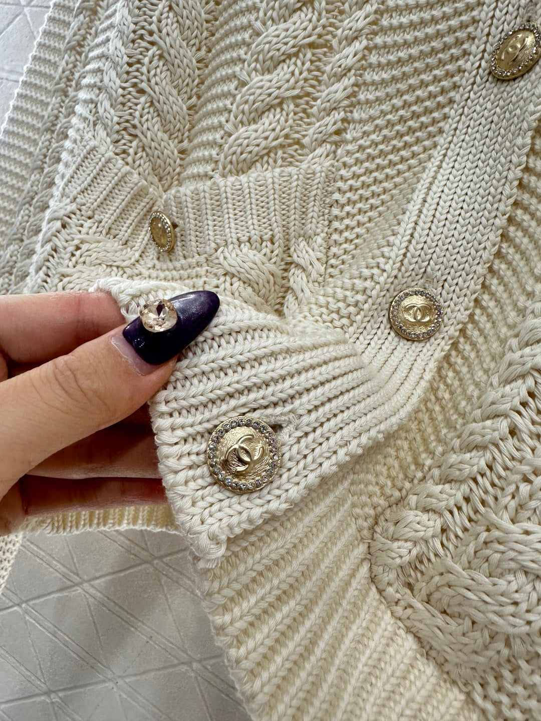Round-neck cable knit cardigan