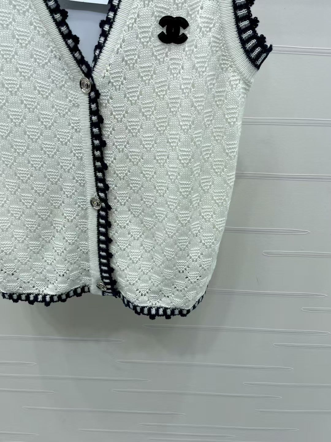 Lace-trimmed knitted vest
