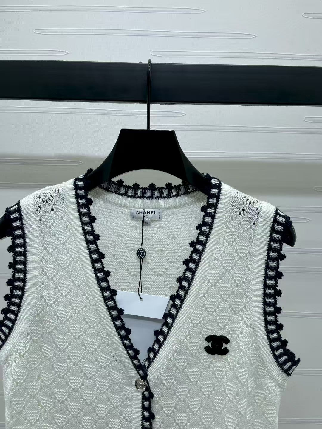 Lace-trimmed knitted vest