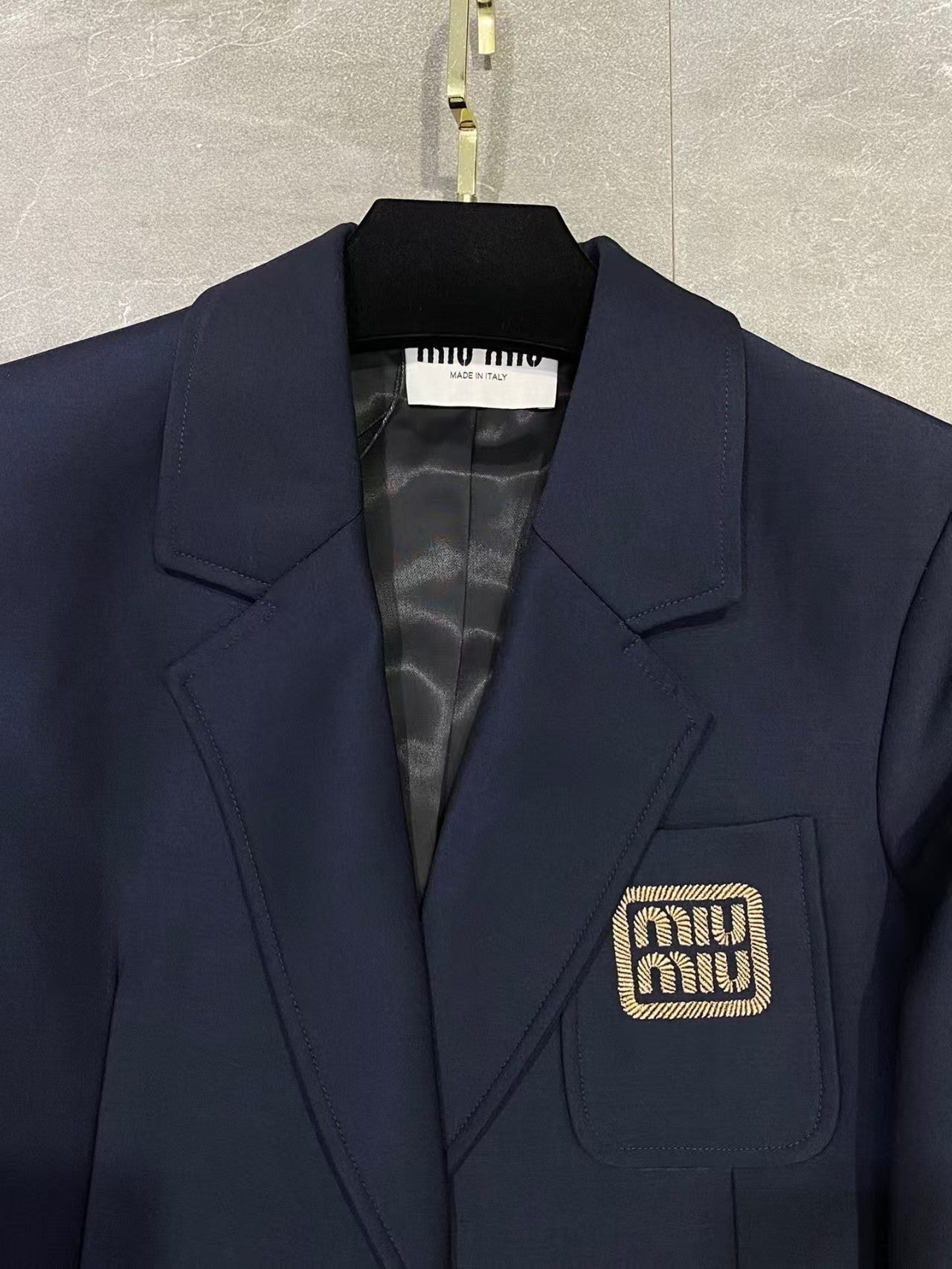 Embroidered lettering logo jacket