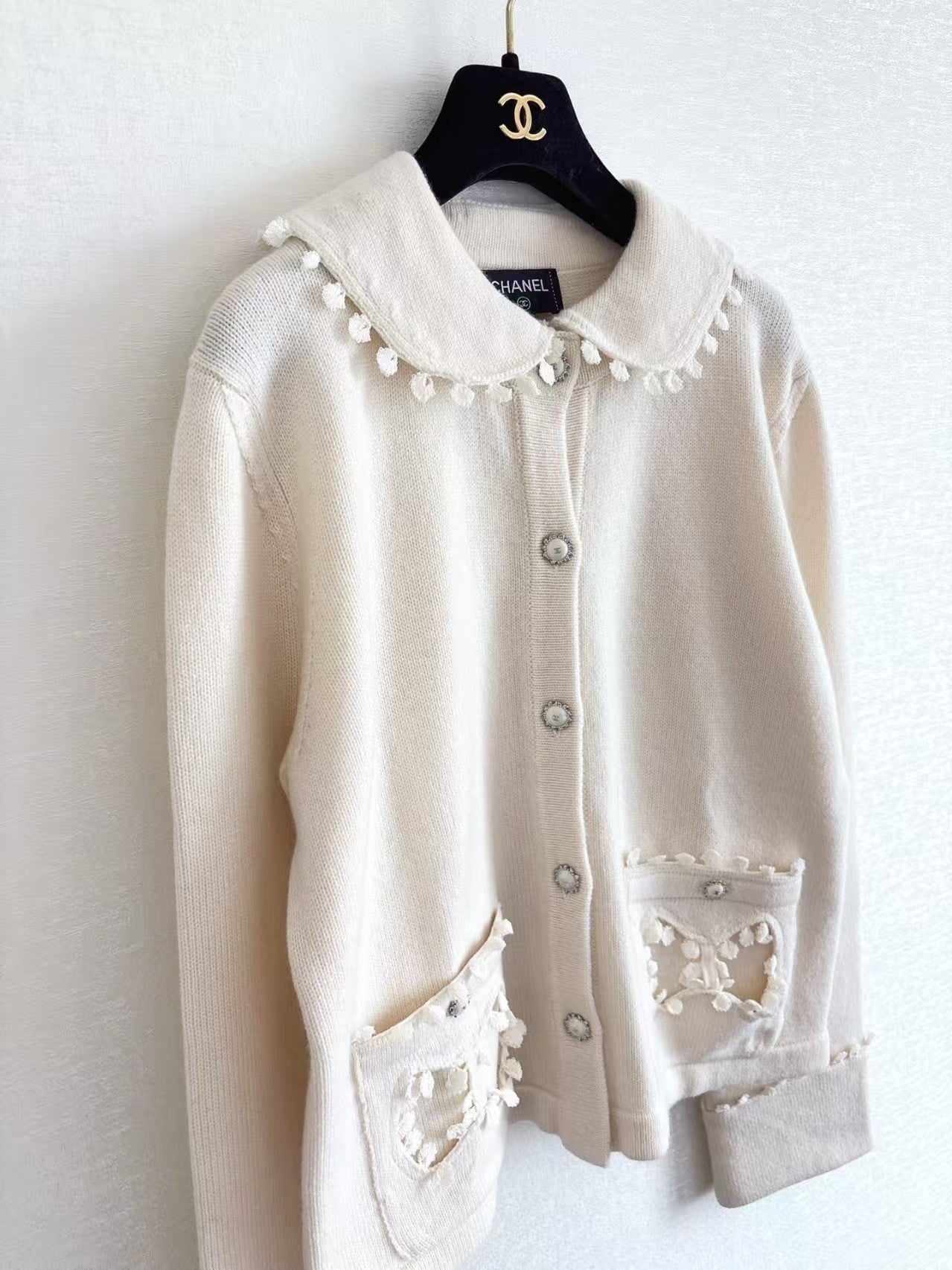 New openwork pocket Peter Pan collar cardigan