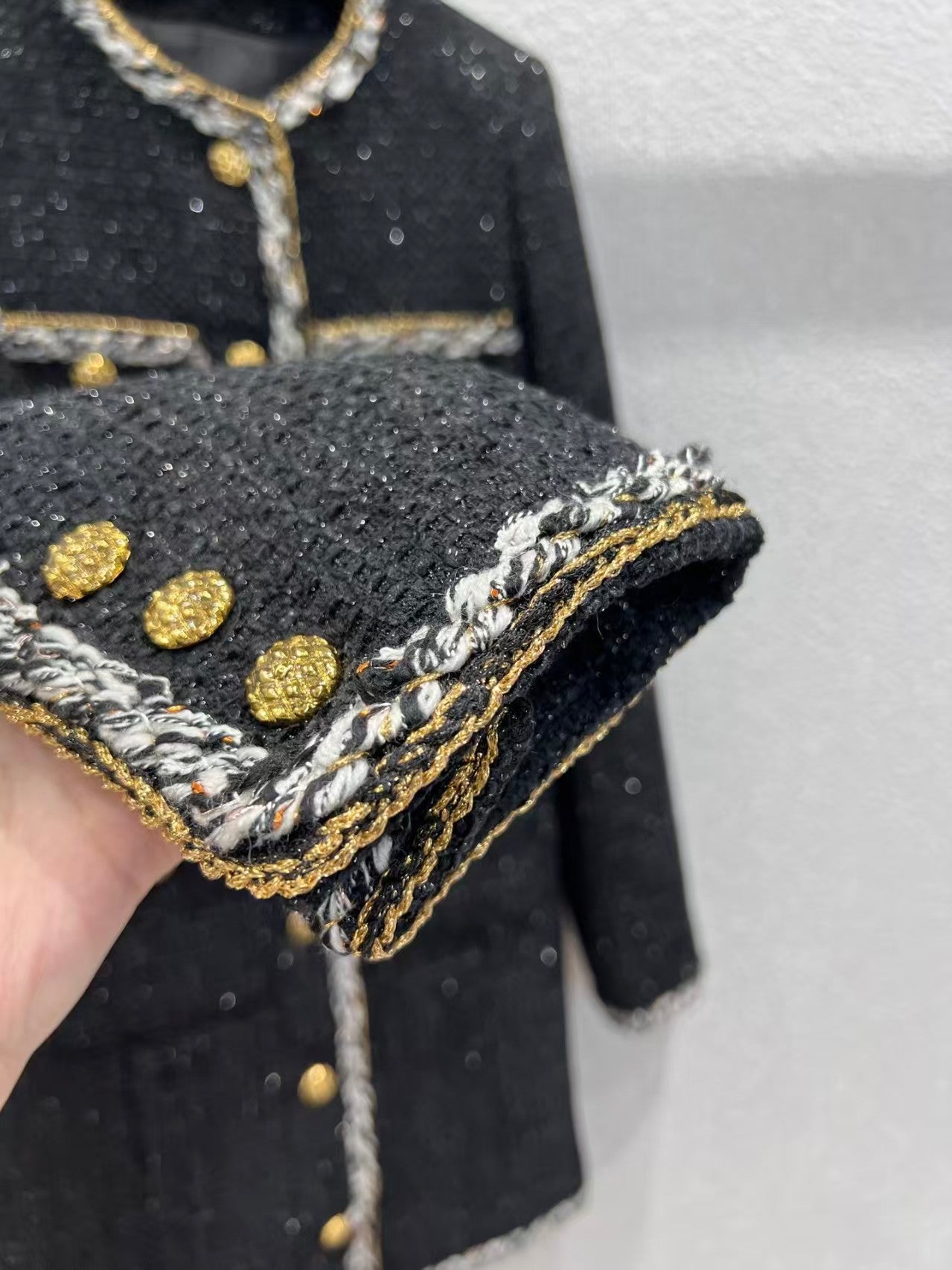 Black and gold four-pocket tweed coat