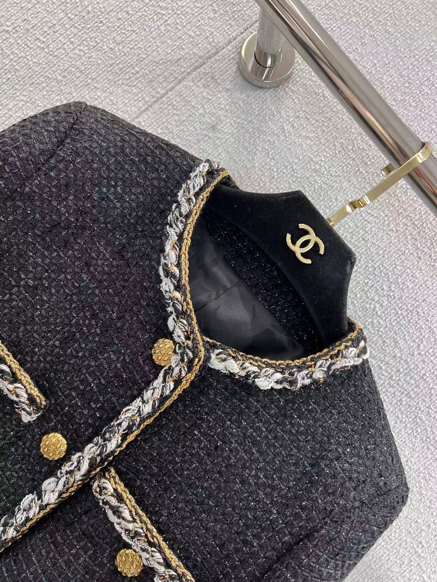 Black and gold four-pocket tweed coat