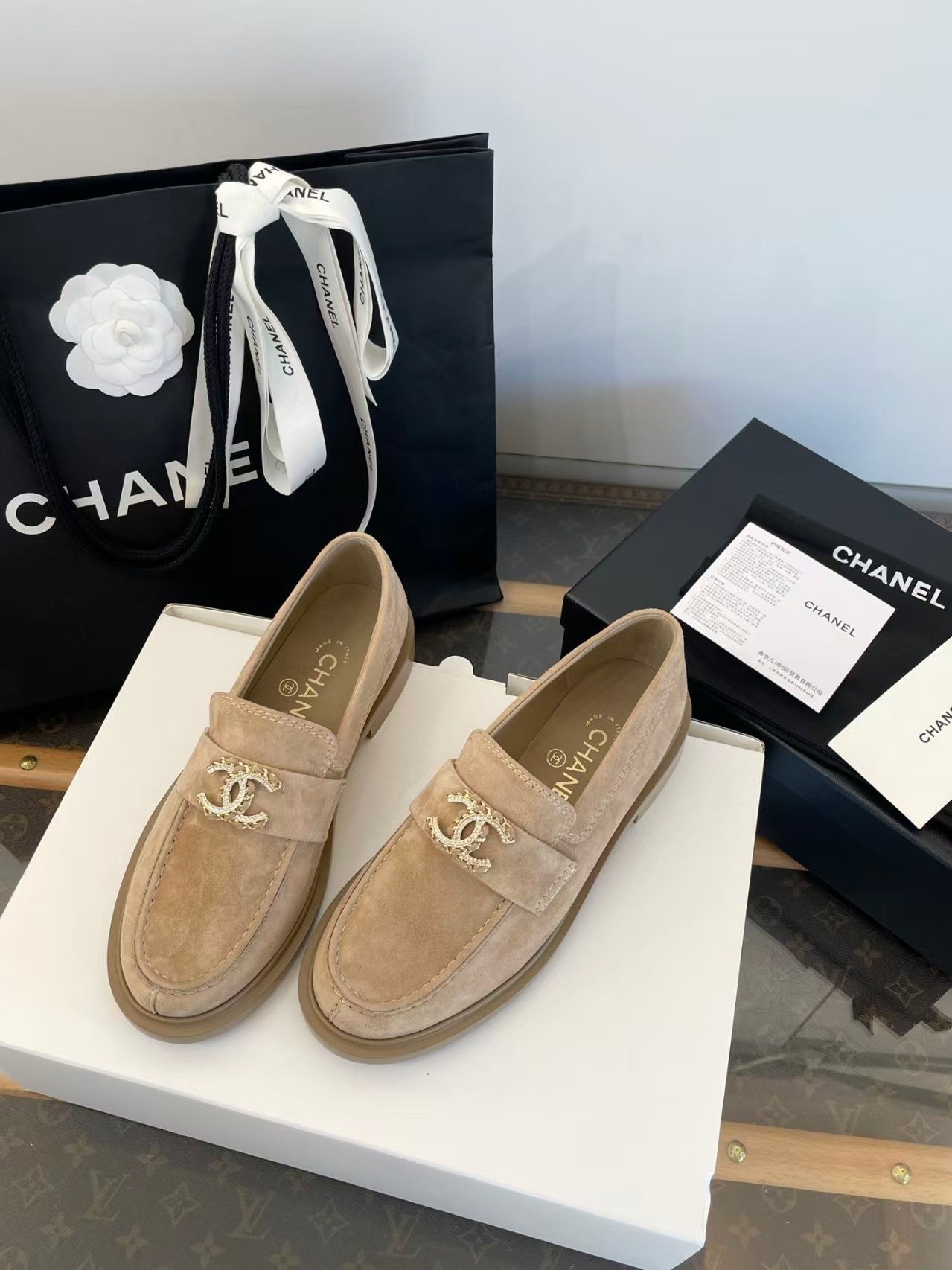 Gold buckle suede loafers