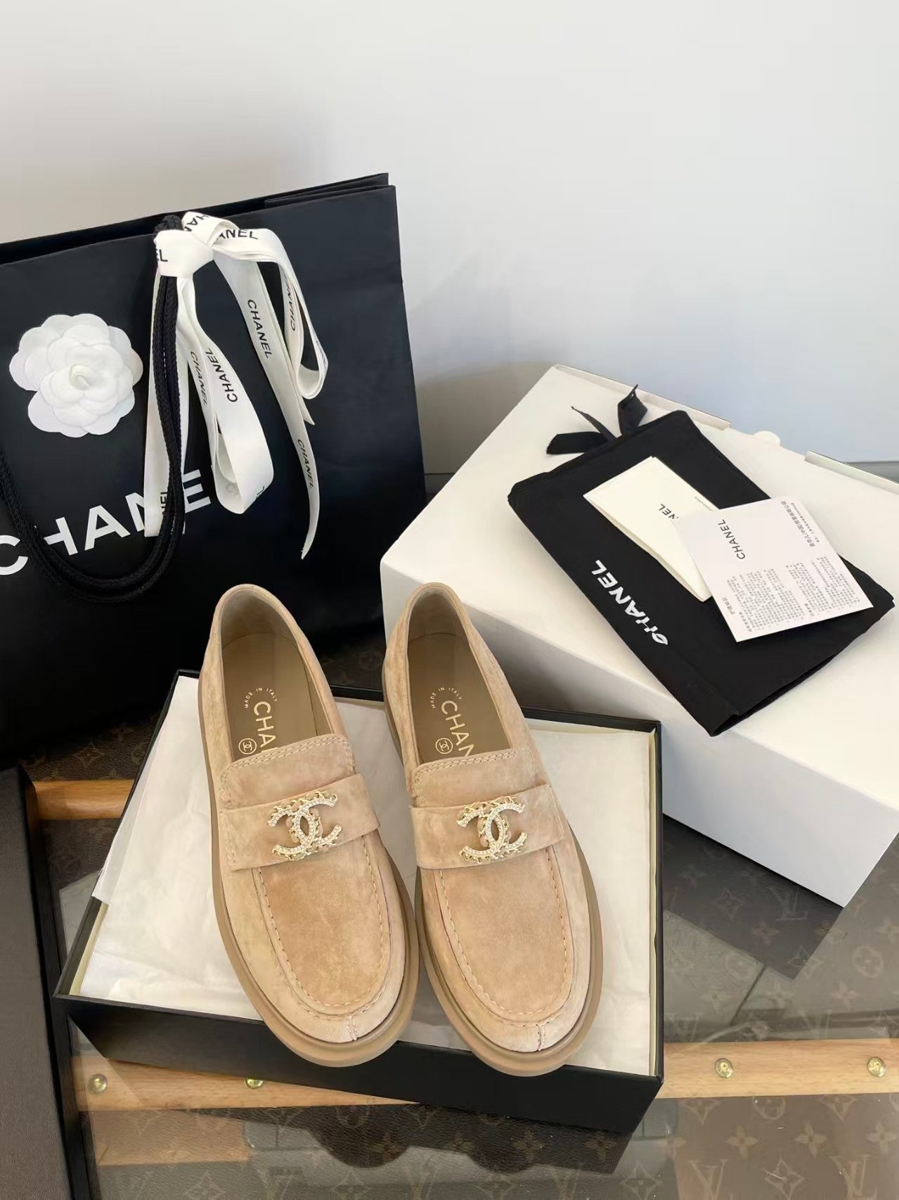 Gold buckle suede loafers