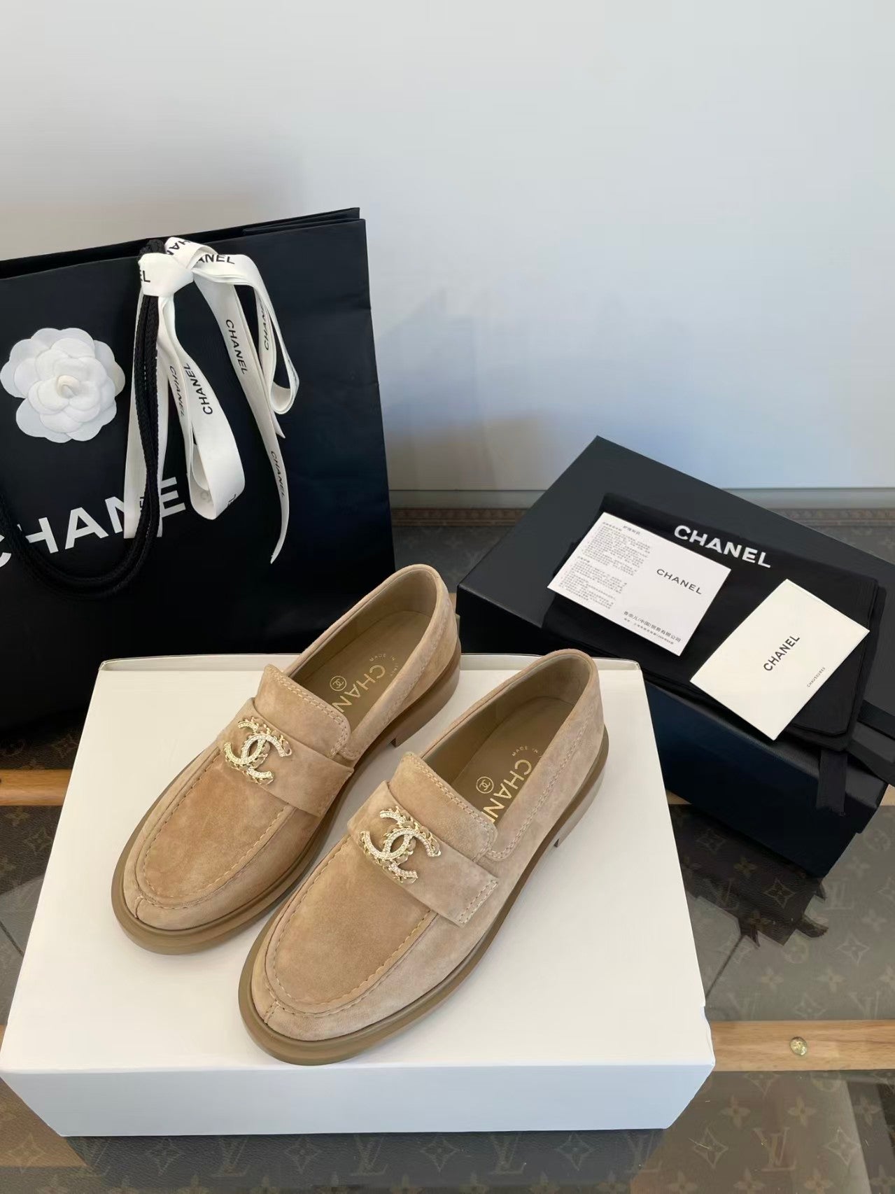 Gold buckle suede loafers