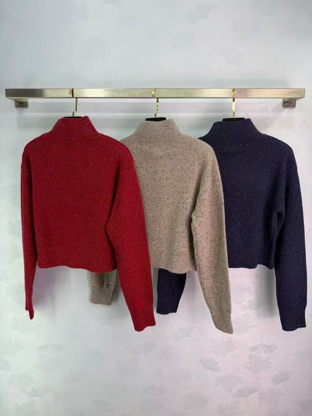 Stand-up collar triangular logo sweater