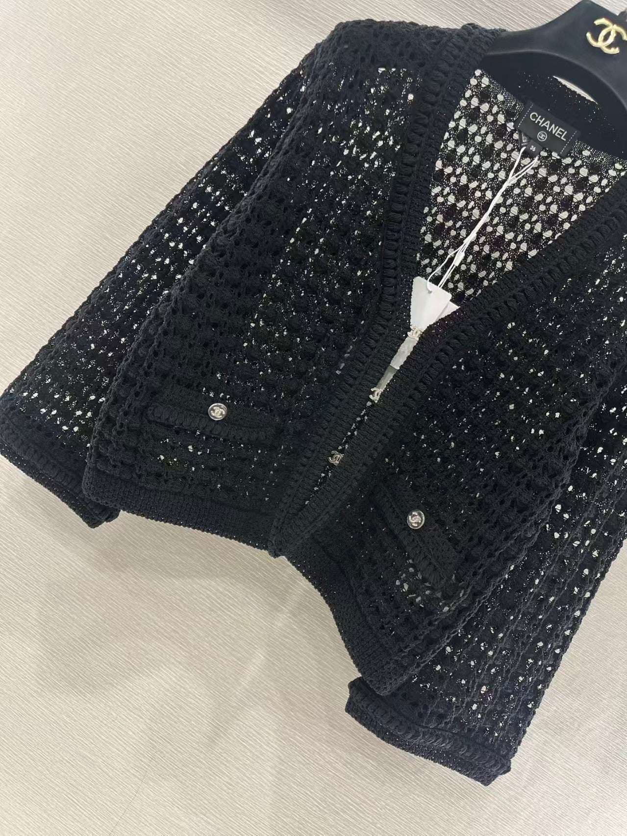Openwork short-sleeved knitted cardigan