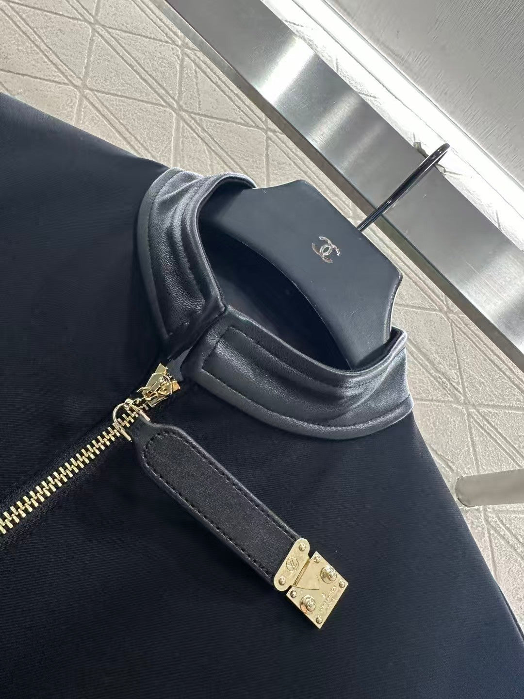 Jacket with zippered leather collar