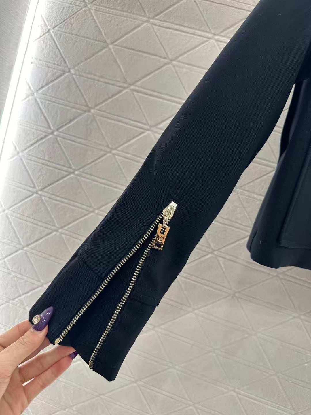 Jacket with zippered leather collar