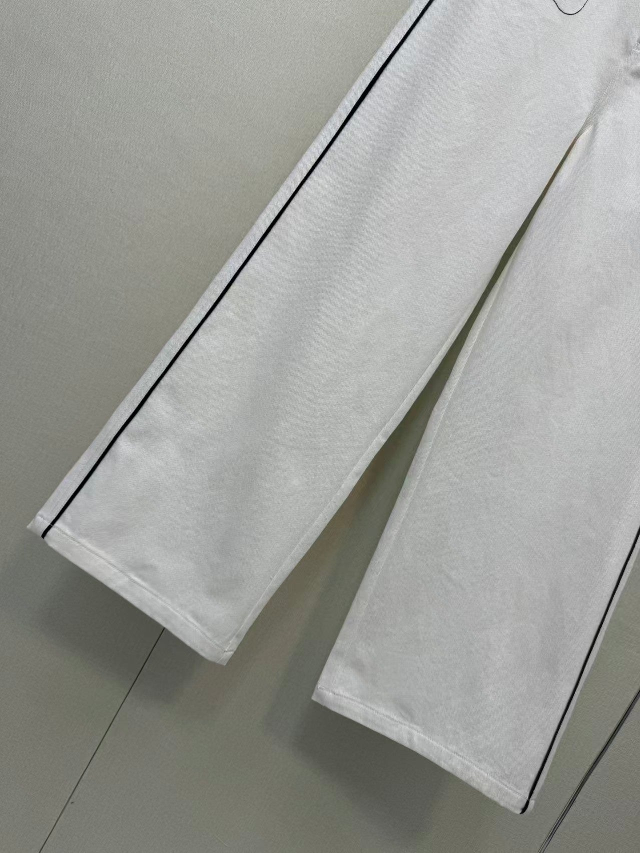 New double-C white denim jeans
