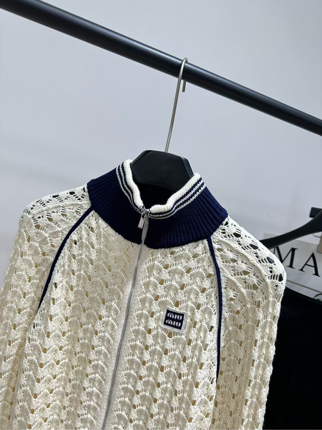 26SS Beige Badge Stand Collar Hollow-Out Cardigan
