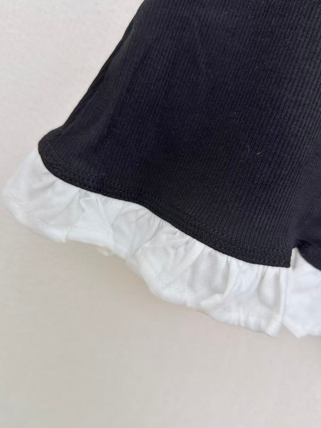 26 New Ruffled Sleeveless Top