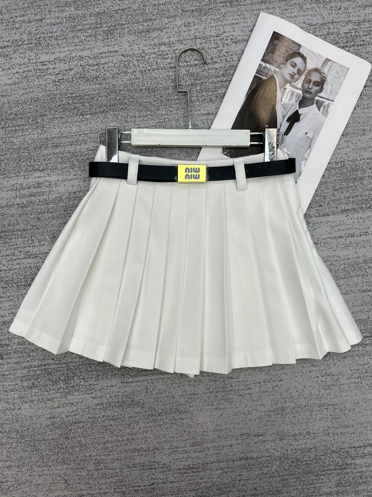 New style pleated skirt with belt.