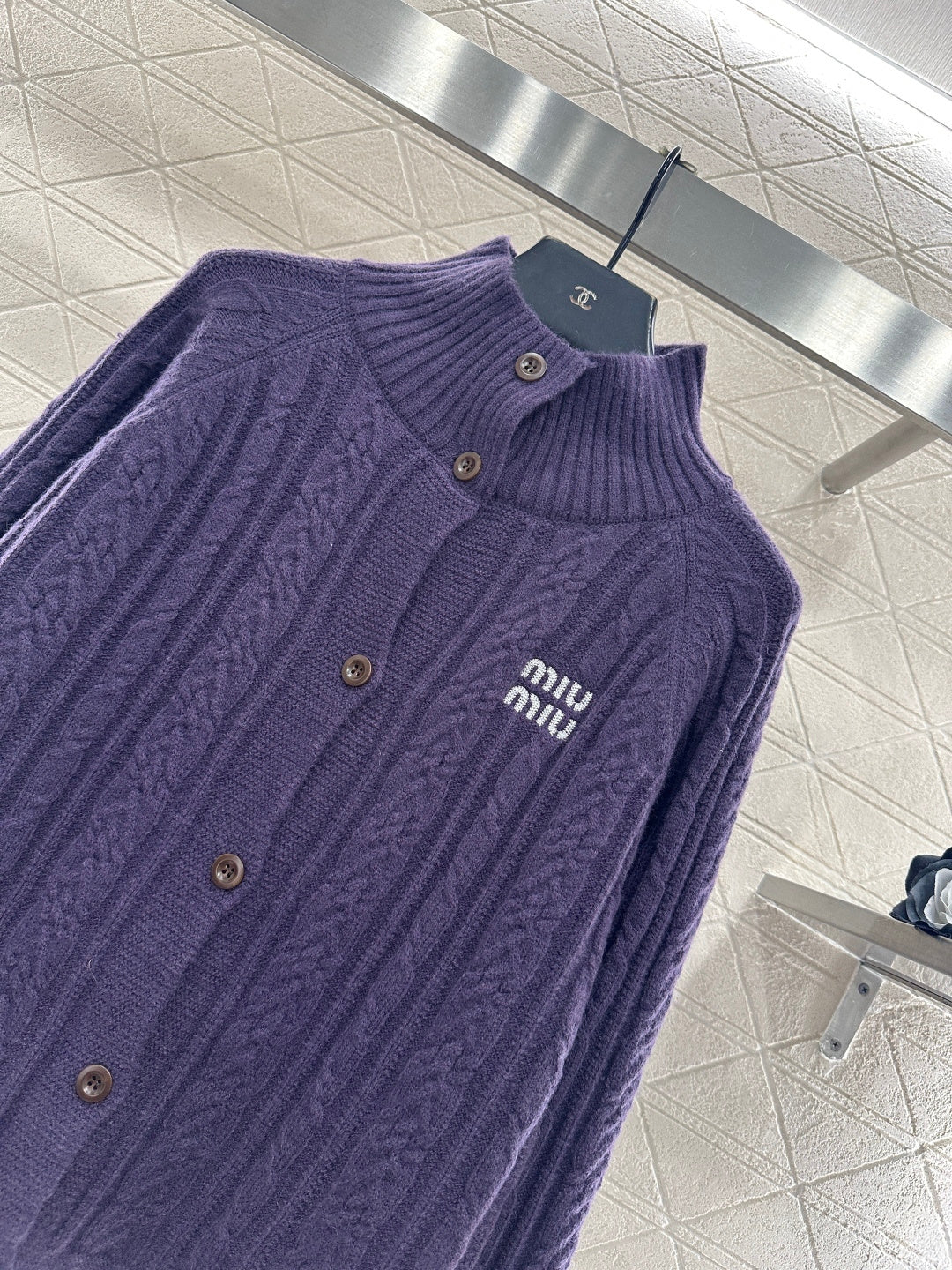 Cable knit cardigan with logo
