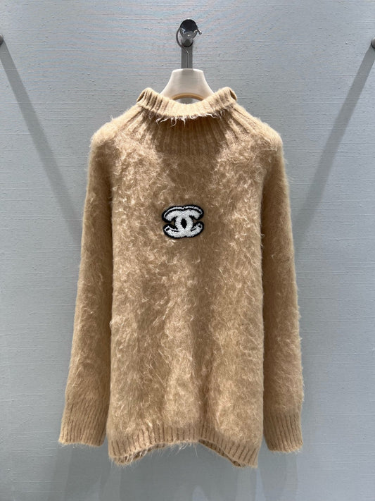 New camel-colored knitted sweater