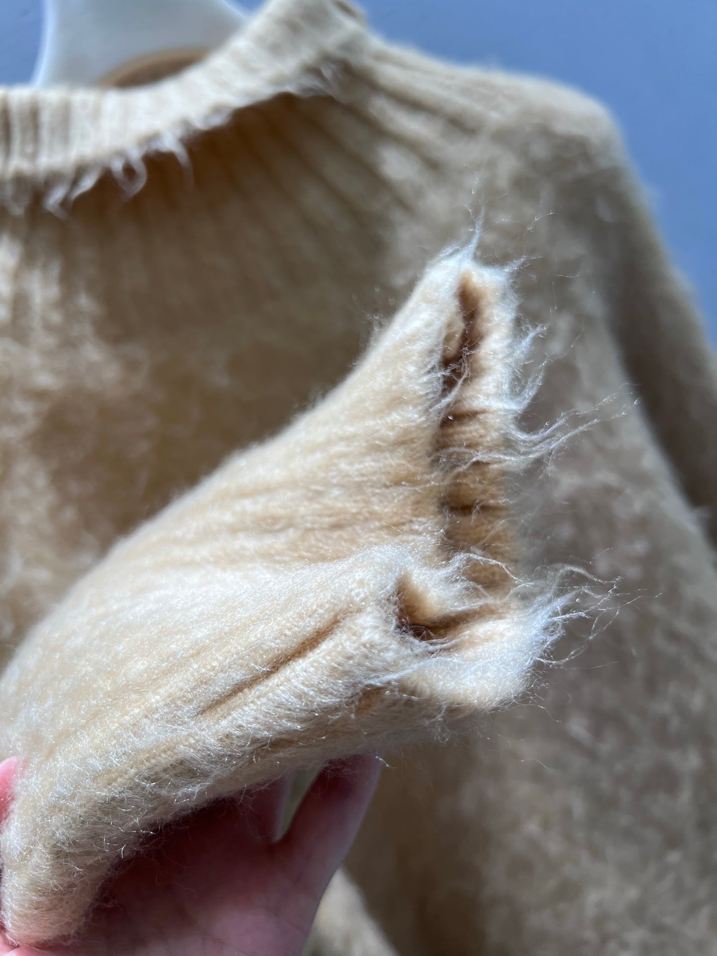 New camel-colored knitted sweater