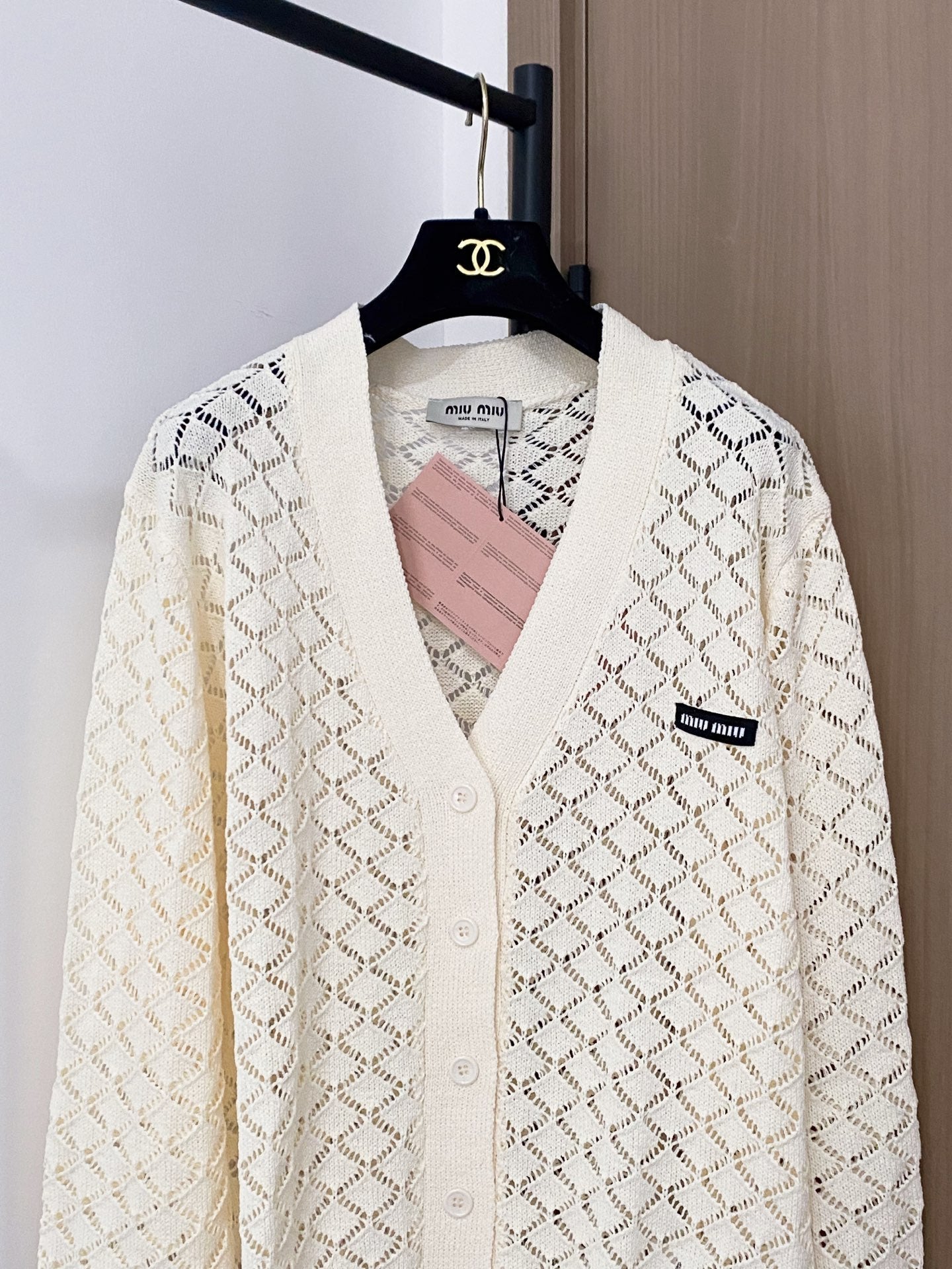 Cardigan embellished with logo details.