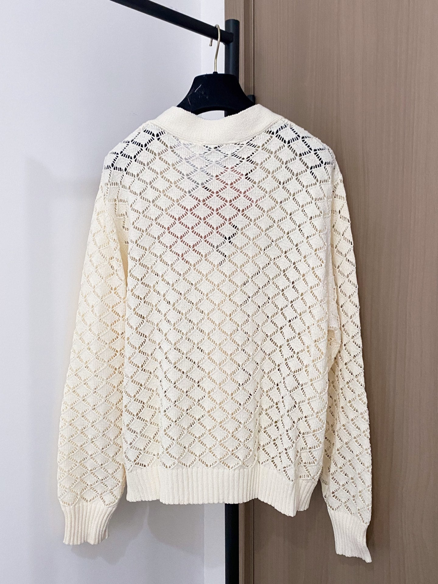 Cardigan embellished with logo details.