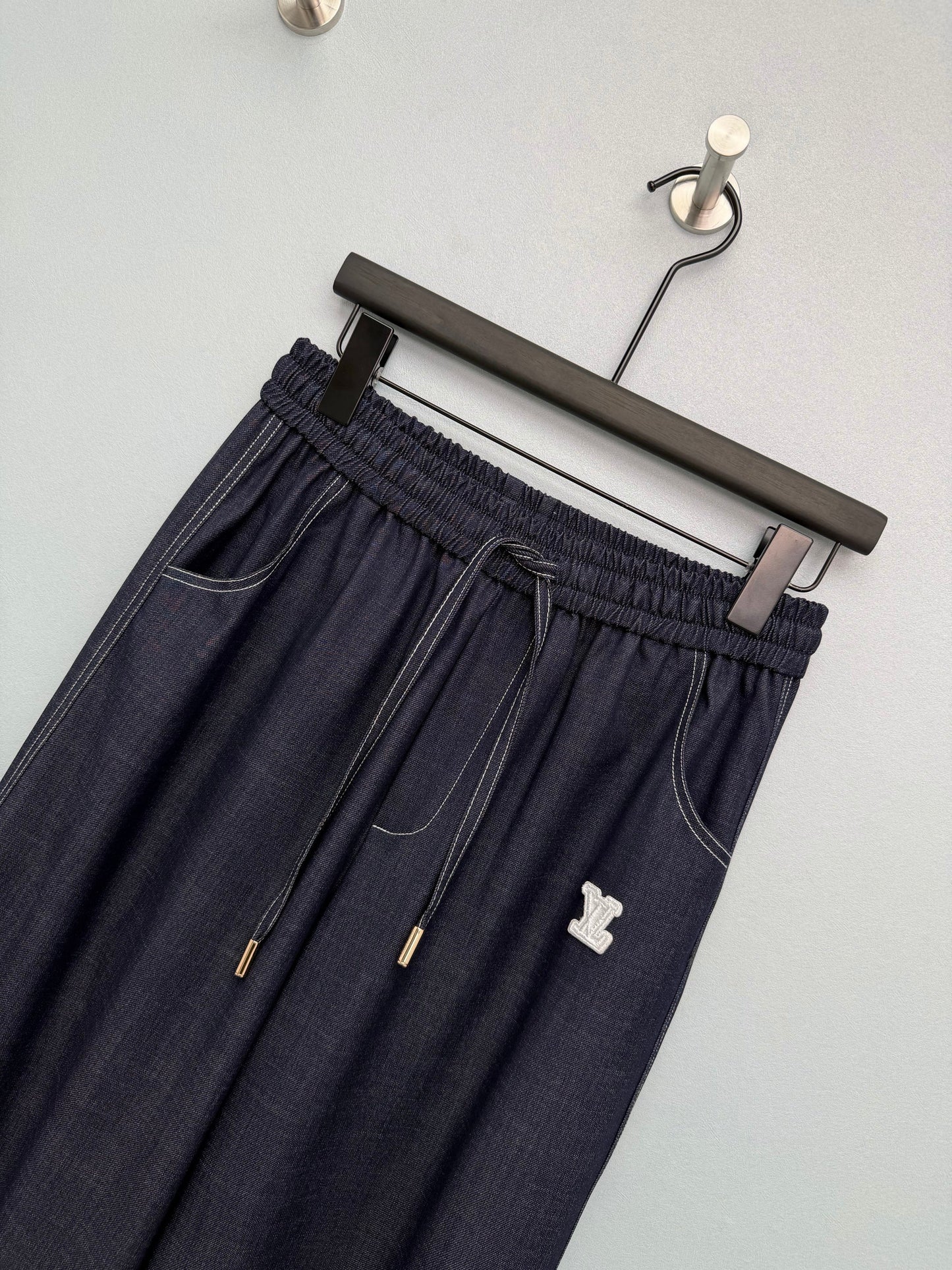 26. Wide-Leg Trousers with Side Drawstrings and Exposed Stitching