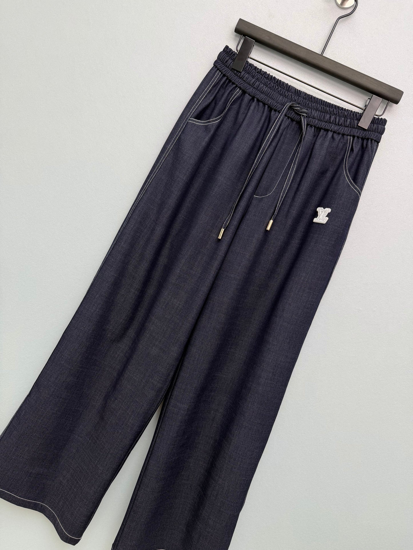 26. Wide-Leg Trousers with Side Drawstrings and Exposed Stitching