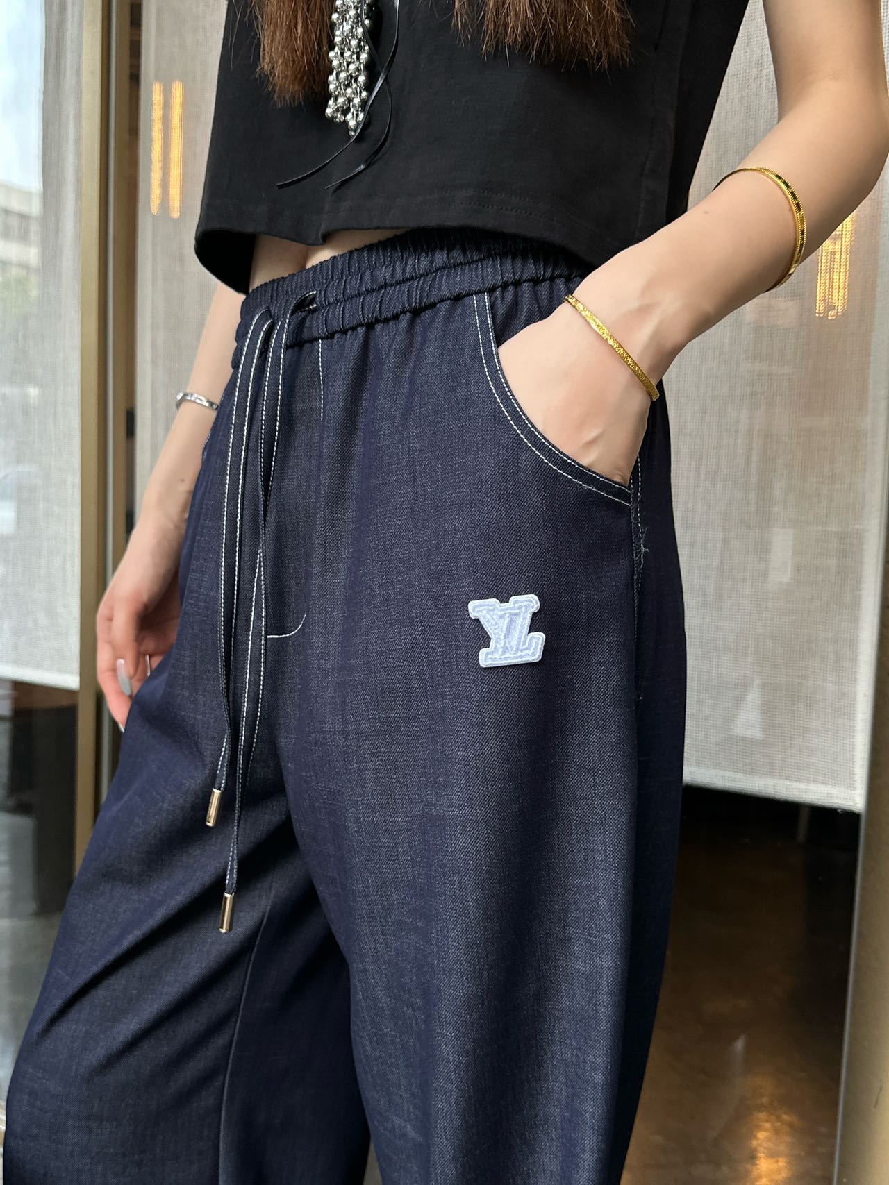 26. Wide-Leg Trousers with Side Drawstrings and Exposed Stitching